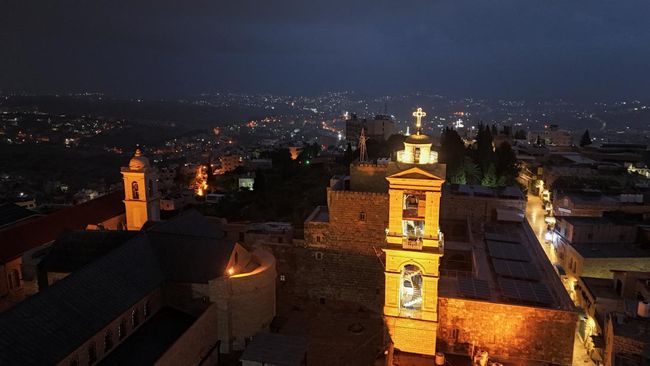 FOTO: Hening Lonceng Natal Kota Bethlehem di Tengah Kecamuk Perang